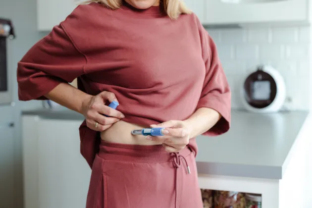 A person injecting insulin. Photo: iStock